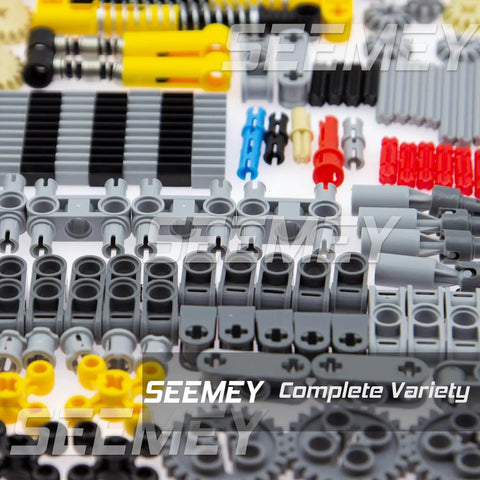 Close-up of Massive 844Pcs Pin Gears Axles Set for RC Cars and Tanks, showing gray, yellow, and red components arranged neatly.
