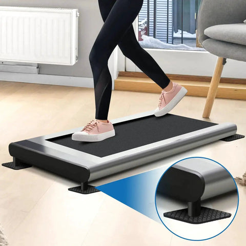 Person using treadmill on 4 Pack Double Sided Treadmill Floor Mat Pads Grippy Non Slip Anti Vibration Cushions Protect Hardwood Floors Safely