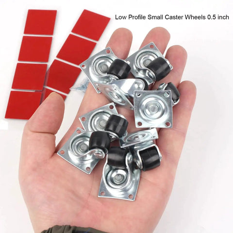 Hand holding Half Inch Mini Swivel Caster Wheels With Steel Top Plate Self Adhesive Nylon Rolling Casters For Furniture And Small Appliances