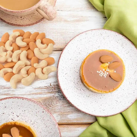 Set Of 100 Realistic Fake Almond And Cashew Nuts For Home Decor And Photography Props One Inch Mini Size on a wooden table with dessert