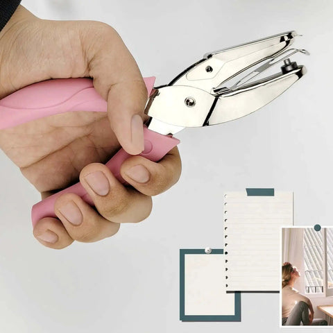 Handheld Circle Hole Punch One Ninth Inch Three Mm in use showing easy grip handle and punched papers for craft and office projects.