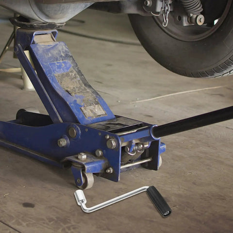 Camper Crank Handle Replacement For RV Trailer Jack Sockets beside blue floor jack under vehicle