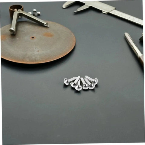 Mini Iron Brads For DIY Projects 100 Pack Paper Craft Fasteners For Shadow Puppet Making Kit And Scrapbooking Embellishments Repairs Metal Fasteners For Craft Junkies arranged on a table with tools