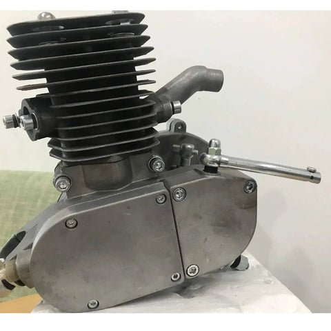 Gas-powered 2-stroke bicycle engine; side view with finned cylinder and clutch lever