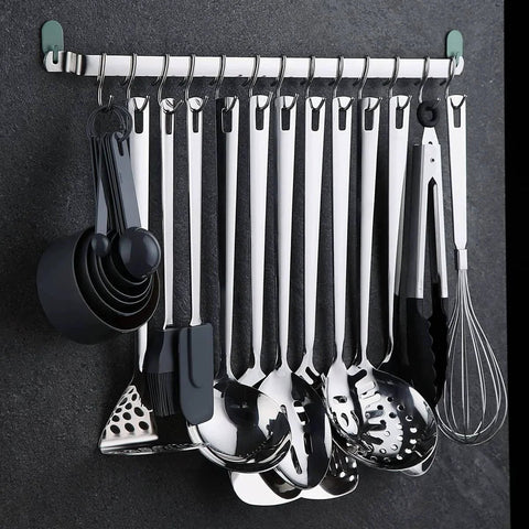Kitchen Utensil Rail Organizer - Wall Mounted Gourmet Rack With 14 Hooks displaying spatulas and ladles