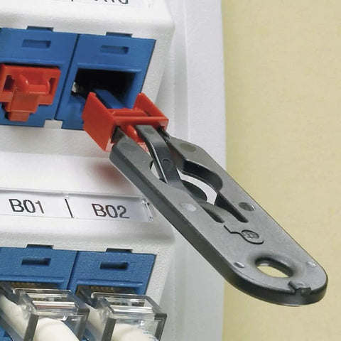 RJ45 Jack Blockout Device Kit With 10 Black Blockouts And Removal Tool installed in data panel