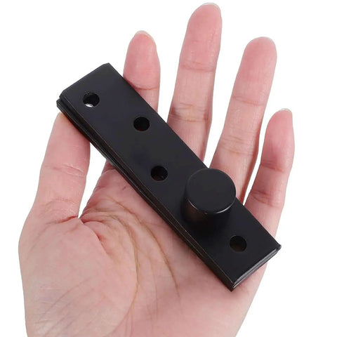 Person holding Hidden Door Pivot Hinge Full Rotation For Wood Doors Beefy Heavy Duty Metal Construction Matte Black Concealed Invisible.