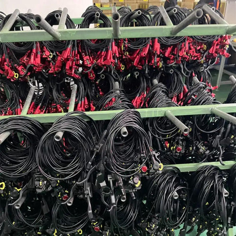 Multiple Zoom HB-875 hydraulic disc brake sets (front/rear) in red with black hoses on racks.