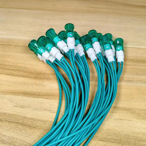 20 Pack Green LED Indicator Lights 10mm Dope Energy Saving LEDs For AC DC 12 24V 0.5W with wires on wooden surface