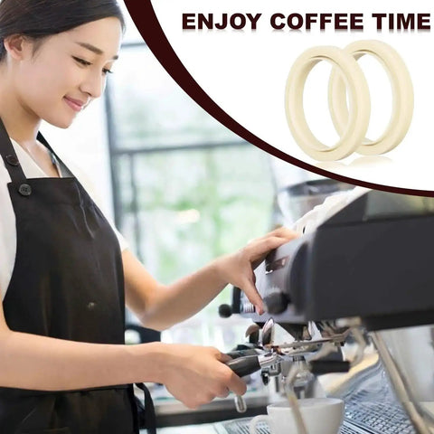 Barista using espresso machine with 54mm silicone steam ring for espresso machines barista grade grouphead gasket replacement visible