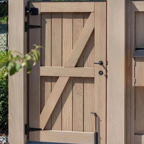 Wooden gate fitted with 12 Pack 5 Inch T Strap Hinges Heavy Duty Outdoor Black Gate Hinges For Wooden Fences Barn Doors Shed Doors