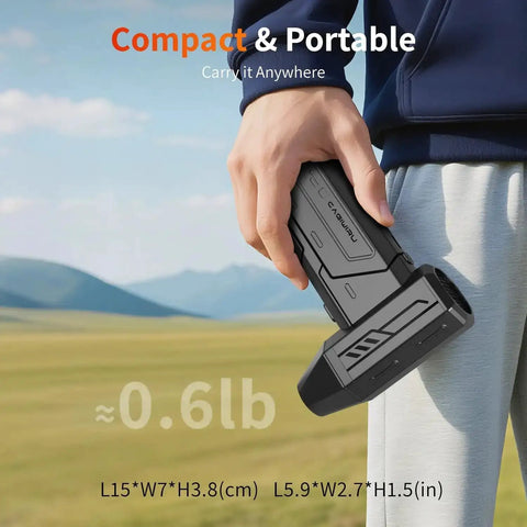 Person holding Powerful 130000 RPM Cordless Air Duster With LED Light, compact size, in outdoor setting.