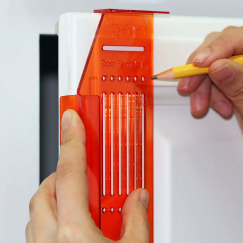 DIY Friendly No-Fuss All In One Cabinet Door And Drawer Drill Mounting Template in use on white cabinet for precise installation