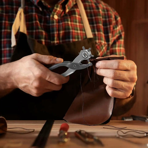 Person using Heavy Duty 9 Inch Leather Hole Punch Tool Rotary Belt Hole Puncher With Ergonomic Non Slip Handle to punch leather.