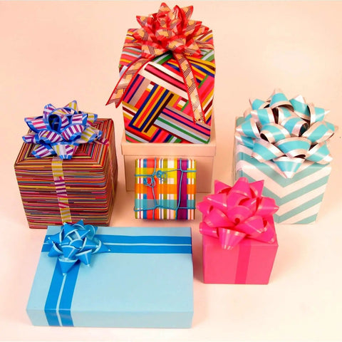 Colorful gift boxes with bows, showcasing Expressions Washi Tape Blue, Repositionable on Most Surfaces, 0.59 In Wide, 32.75 Ft Long