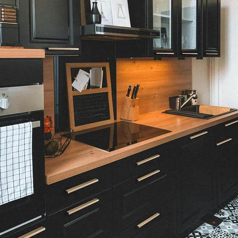Modern kitchen with black cabinets featuring Six Pack Of 5 Inch Champagne Bronze Knurled Cabinet Pulls For Drawers And Dressers