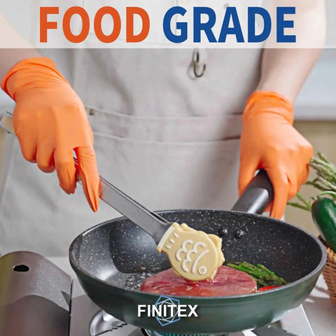 Person using Nitrile Disposable Gloves Orange 3.5mil Medium 100 Count Powder Free Exam while cooking with tongs in kitchen