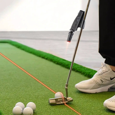 Indoor Golf Laser Putting Training Aid With Dual Modes For Alignment And Stroke Feedback attached to putter on green mat