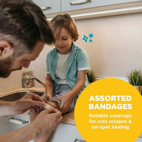 Adult applying bandage from Grab And Go 110 Piece First Aid Kit For Home Office Car Travel Outdoor Sports And School to child's knee.
