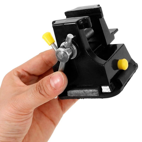 Hand holding Tiny Bench Vise With Suction Base For Portable Table Mount, Quick Install Clamp for crafting and repair projects.