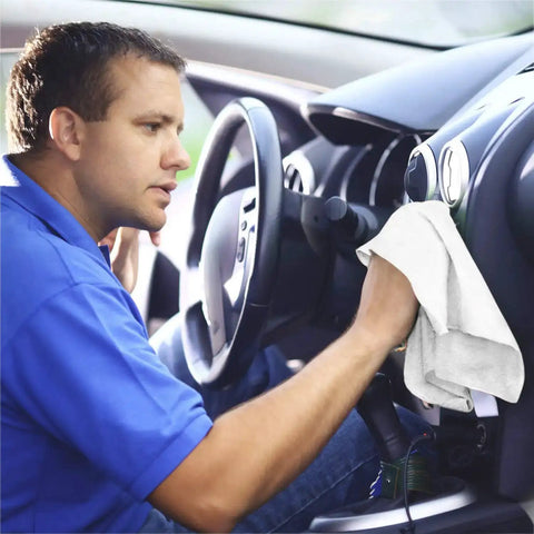 Person using Pack Of 50 Reusable Cotton Rags For Home Garage And Car Detailing Durable Soft 13 By 13 Inch White Towels in car