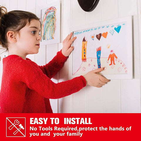 Double-sided heavy-duty foam mounting tape used to hang a child's drawing on a white wall