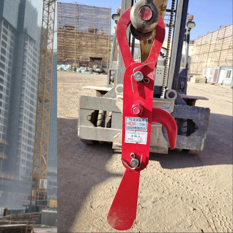 3 Ton Automatic Decoupling Lifting Hook For Forklifts in thickened alloy steel, shown attached to forklift, construction site in background.