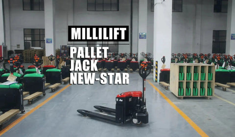 Electric pallet jack in foreground, black with red battery cover, several jacks visible in a warehouse