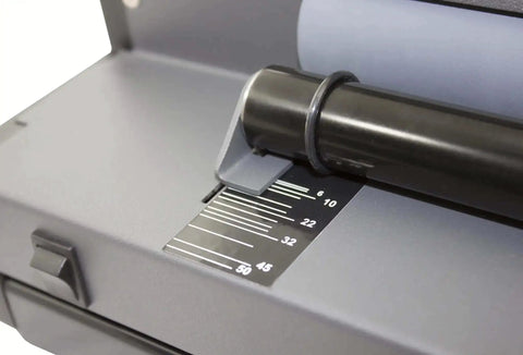 Close-up of All-In-One Coil Punch, Electric Inserter and Electric Coil Crimper with oval holes, showing sheet capacity guide.