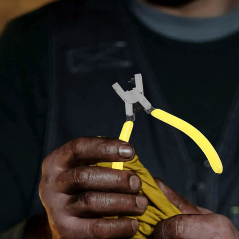 Man using Heavy Duty One Hole Puncher Plier For DIY And Office Use 2mm Metal Paper Punch Tool with yellow handles