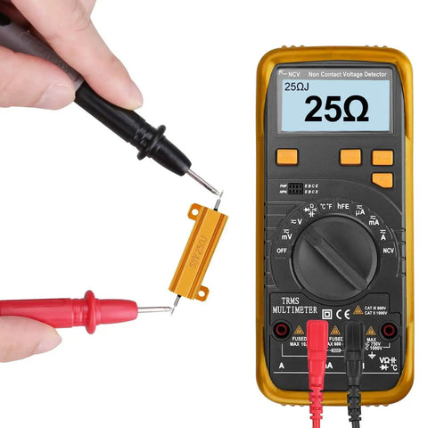 Two TiToeKi 25Ω 50W aluminum chassis-mounted wirewound resistors with screw taps, shown with a digital multimeter