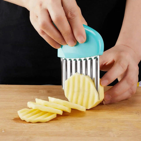 Person using Crinkle Cutter Set With Stainless Steel Waffle Blade Two Pack Veggie Cutter For Potatoes Carrots Lettuce And Butter Cool For Fancy Garnishes And Baby Led Weaning Green And Blue to slice potato