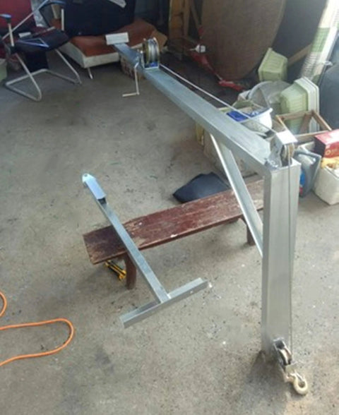 V Type Groove Sliding Gate Roller With Steel Track Wheel installed on metal frame in workshop setting