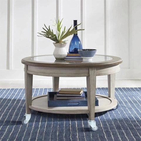 Round coffee table with decorative items on top, featuring 2-Inch Swivel Stem Caster Set For Weber Grill And Shop Vac, 4-Pack Replacement Wheels.