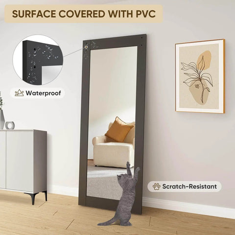 36 Inch Wide By 84 Inch Tall Mirror Barn Door Built Tough With 6.6 Foot Sliding Hardware Kit Included One Lite Full Length Glass Solid Wood Waterproof PVC Surface Scratch Resistant No Assembly Required Black leaning against a living room wall.