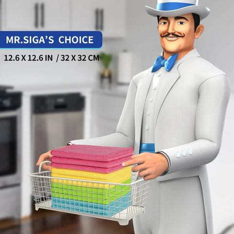 Cartoon character holding stack of colorful cleaning cloths in a kitchen setting, labeled Ultra Soft Microfiber Cleaning Cloths Pack Of 12 12.6 X 12.6 Absorbent Scratch Free.