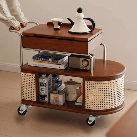 Wooden kitchen cart with books and tea set on top, equipped with 1 inch low profile caster wheels for easy movement.
