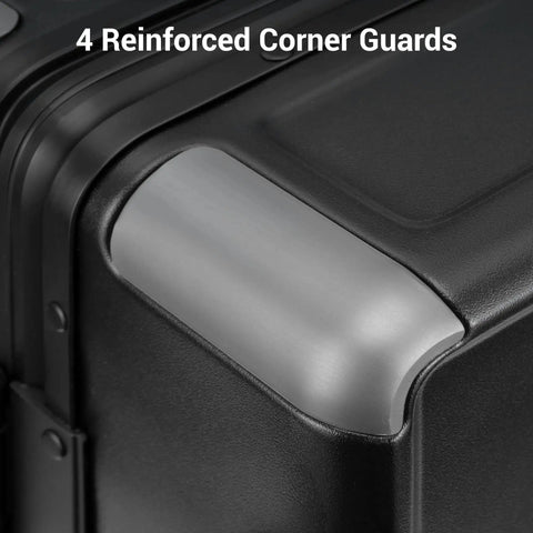 Close-up of black zipperless carry-on luggage with aluminum frame and reinforced corner, highlighting strength and durability.