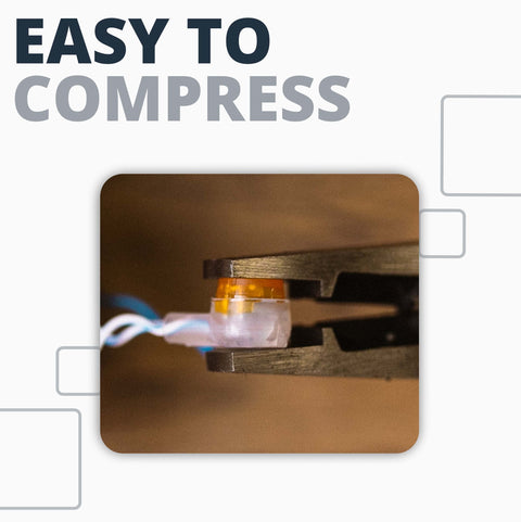 Corning UY2 Presslok splice terminal, clear plastic housing with orange insert being crimped by a metal tool