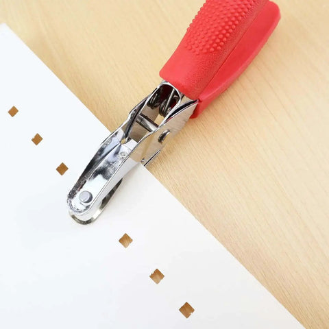 Square Hole Paper Punch 3 Sixteenth Inch Handheld Puncher with Red Soft Grip Handle in use on paper, creating square holes