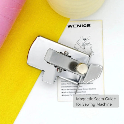 Front view of a silver magnetic seam guide for sewing machine with knob, shown beside yellow fabric and WENICE card.