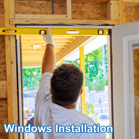 Person using a level tool for window installation in a wooden frame construction setting.