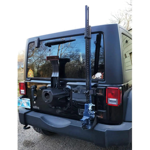 Jeep with jack installed, featuring Jack Handle Keeper For Jacks With Secure Latch And Abrasion Resistant Silicone