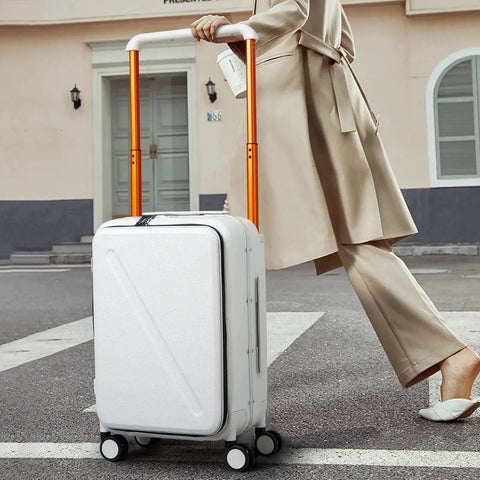 Person walking with 20 Inch Carry On Luggage With Front Pocket And Front Opening Design Aluminum Hardside Spinner Wheels TSA Lock Airline Approved