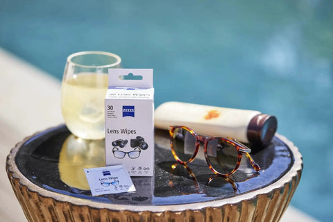 ZEISS Premium Sunglasses Wipes Pre Moistened 120 Count Safe For All Lenses with sunglasses by a poolside