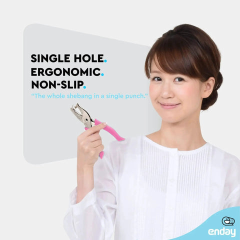 Woman holding Metal Single Hole Punch For Paper And Crafts With Soft Grip Handles, Pink Quarter Inch Hole Puncher, ideal for scrapbooking.