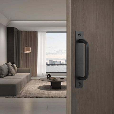 Black Barn Door Handles 4 Pack With 5 Inch Hole Center Aluminum Sliding Door Pulls installed on wooden door.