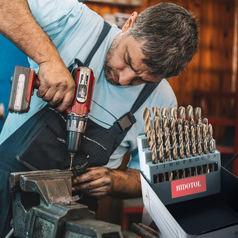 26 Piece Cobalt M35 HSS Letter Drill Bit Set A Through Z With Indexed Metal Case For Hardened Metal Stainless Steel Cast Iron Plastic And Wood, Self Centering 135 Degree Point For Fast, Precise Drilling Jobsite Ready, shown with a person using a drill.