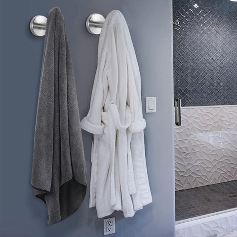 304 Stainless Steel Towel Hooks And Robe Hooks Wall Mounted With Brushed Nickel Finish holding a towel and robe in a bathroom.