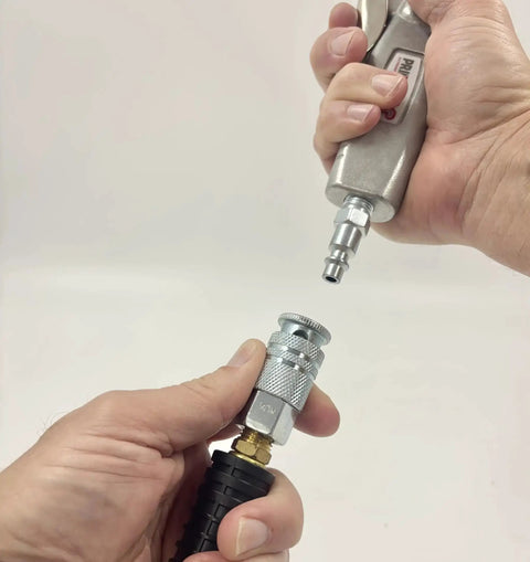 Industrial Style Air Quick Connect Plugs Nipples In Heat Treated Steel One Quarter Inch Male NPT shown connecting to air tool